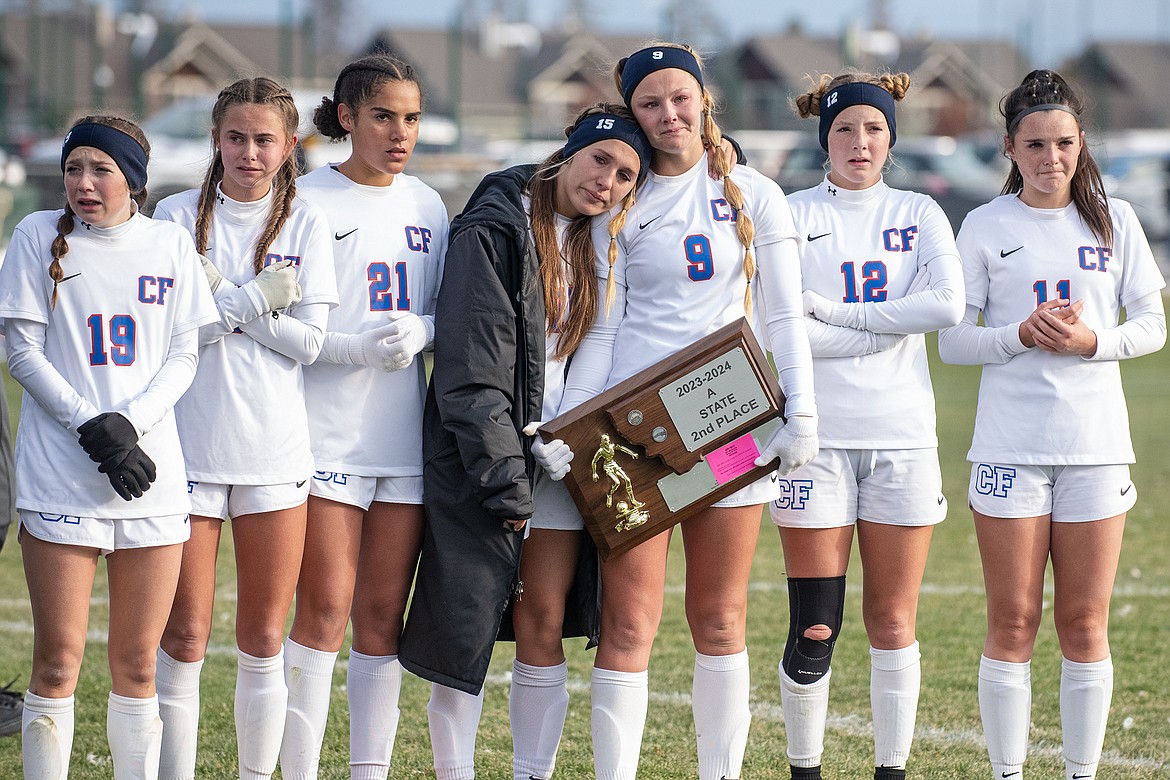 Wildcats Taylor Rodgers, Mila Johns, Apani Awua, McKenzee West, Hope McAtee, Josie Harris and Riley Byrd accept their second place trophy after falling to Whitefish in the Montana A girls soccer championship on Saturday, Oct. 28.