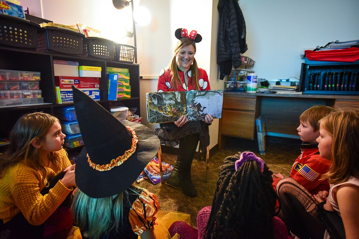 Teacher Karen Reece reads a spooky story to her second-grade class at Lakeside Elementary School on Tuesday, Oct. 31. Students and staff at Lakeside Elementary dressed up for Halloween. (Casey Kreider/Daily Inter Lake)