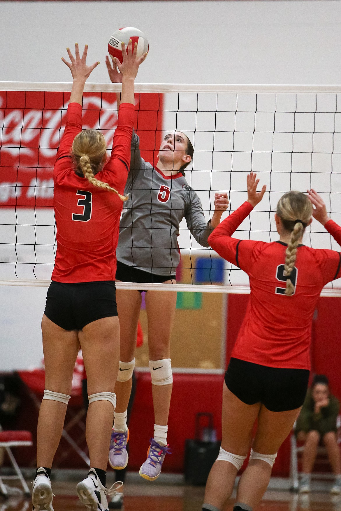 Sandpoint's Aubree Lane looks to tap the ball over two Moscow defenders in a game earlier this season at Les Rogers Court.