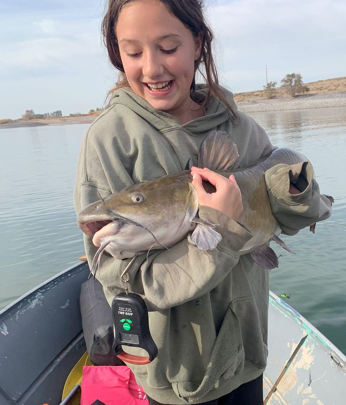 Aby caught this 20-pound channel catfish while jigging a Whistle Pig on her ice-fishing setup. Her dad was very proud. Fall is a great time to fish cats on Potholes Reservoir.