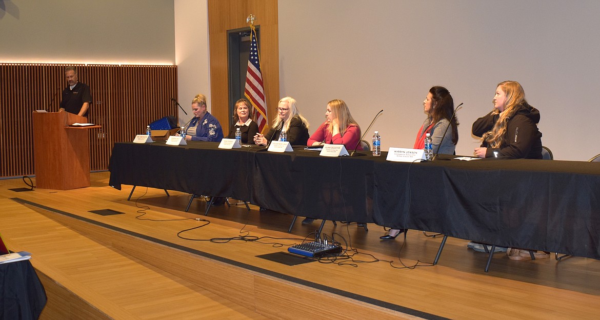 From left, moderator Alan Heroux reads a question for Moses Lake School Board candidates Amy Breitenstein, Shannon Hintz, Susan Freeman, Carla Mayberry Urias, Alana DeGooyer and Kirryn Jensen.