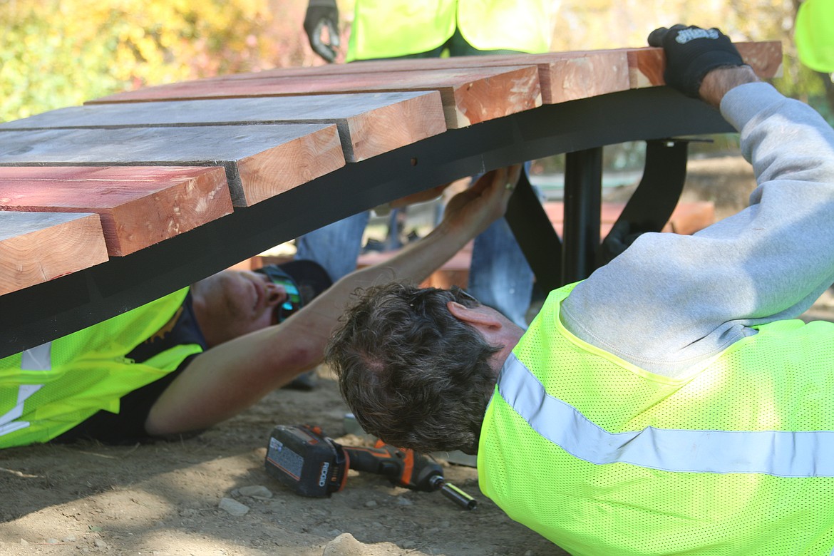 Pend Oreille Pedalers volunteers install a feature at the Tiny Woods bike skills course, part of the Travers Park complex.