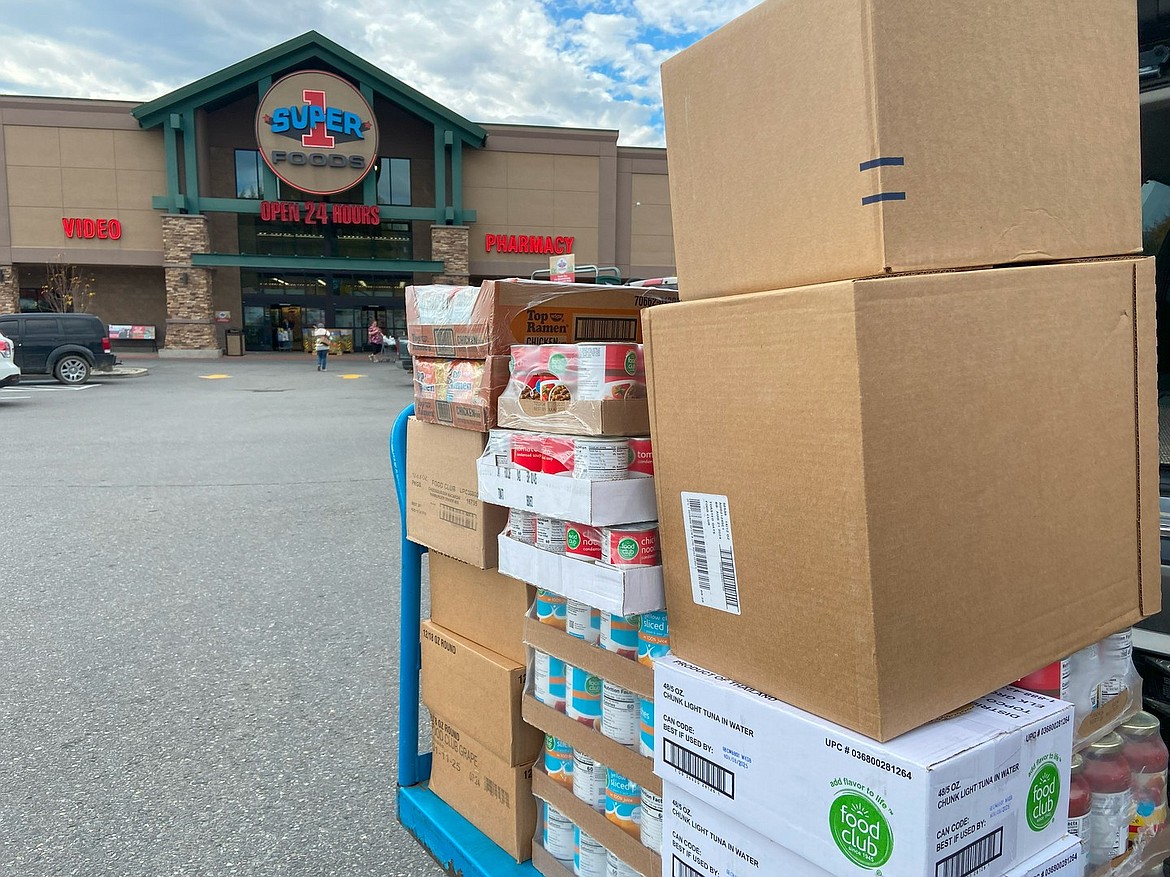 Local real estate officials and mortgage lenders volunteer at the Selkirk Association of Realtors' fall food drive.