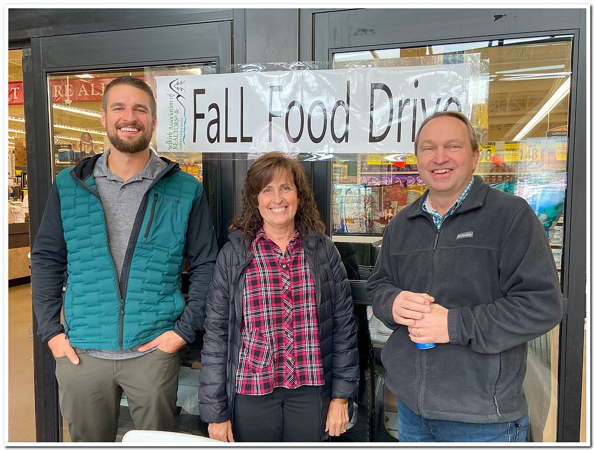 Local real estate officials and mortgage lenders volunteer at the Selkirk Association of Realtors' fall food drive.