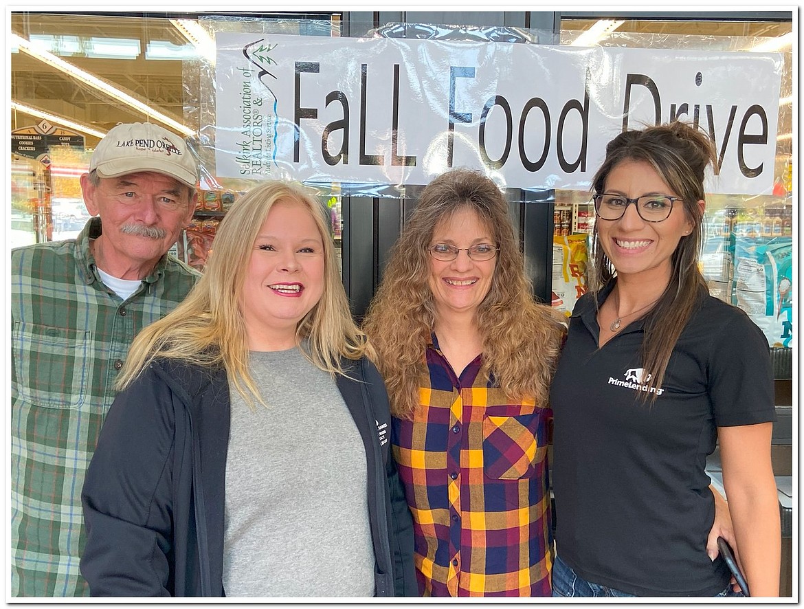 Local real estate officials and mortgage lenders volunteer at the Selkirk Association of Realtors' fall food drive.