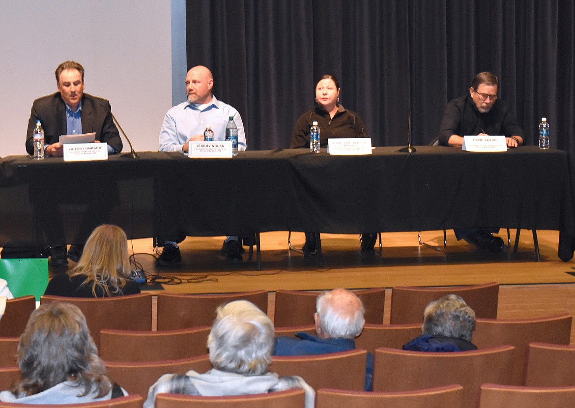 From left: Moses Lake City Council candidate Victor Lombardi answers a question at the Moses Lake candidates forum Oct 24, as candidates Jeremy Nolan, Elisia Dalluge and David Skaug listen.