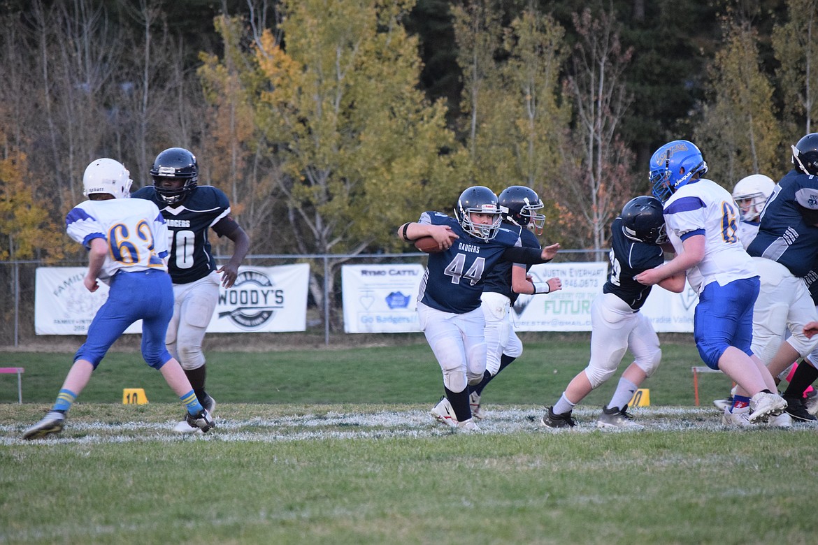 BCMS running back Mark Elliston hits an opening as the Badgers claimed a 12-6 win over the Libby (Mont.) Loggers this past weekend.