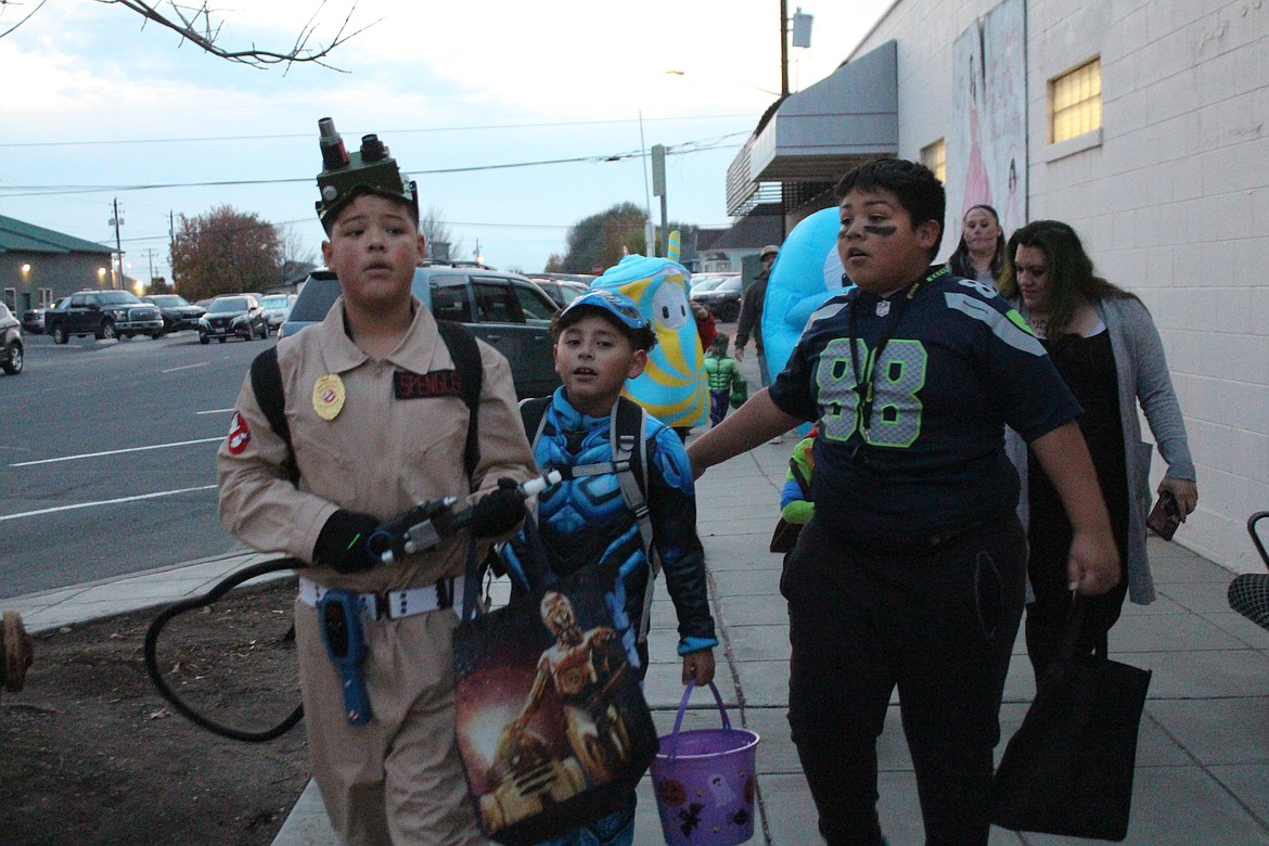 Trick-or-treaters searched for candy along Quincy’s Central Avenue North Tuesday.