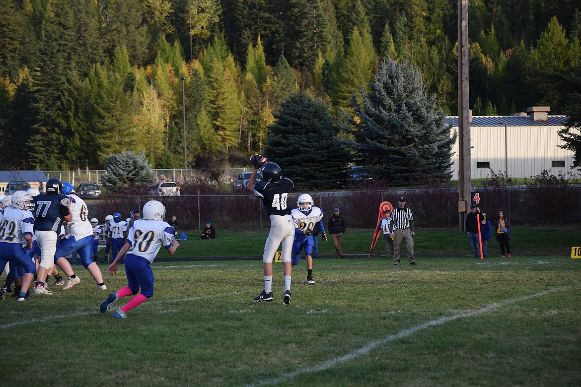 Tannum Allred leaps to make a catch as the BCMS Badgers took on the Libby Loggers last weekend.