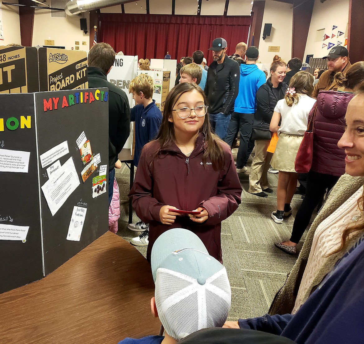 Coeur d'Alene Charter Academy sixth grader Isabella Baker gathered over 100 cans of food donations for a local food bank for her good deed project. She presented the experience Wednesday to her friends, classmates and their parents.