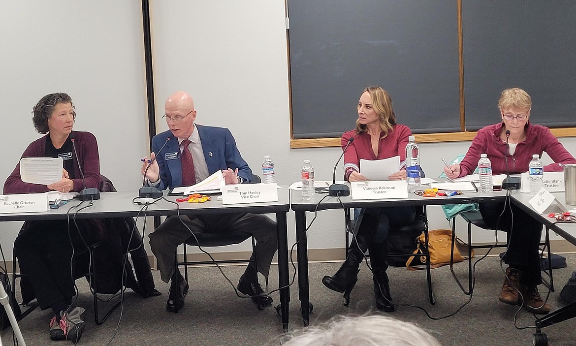 Vice Chair Tom Hanley weighs in on a draft of the materials selection policy Thursday during a special meeting of the Community Library Network's board. From left: Chair Rachelle Ottosen, Hanley, Trustee Vanessa Robinson and Trustee Katie Blank.