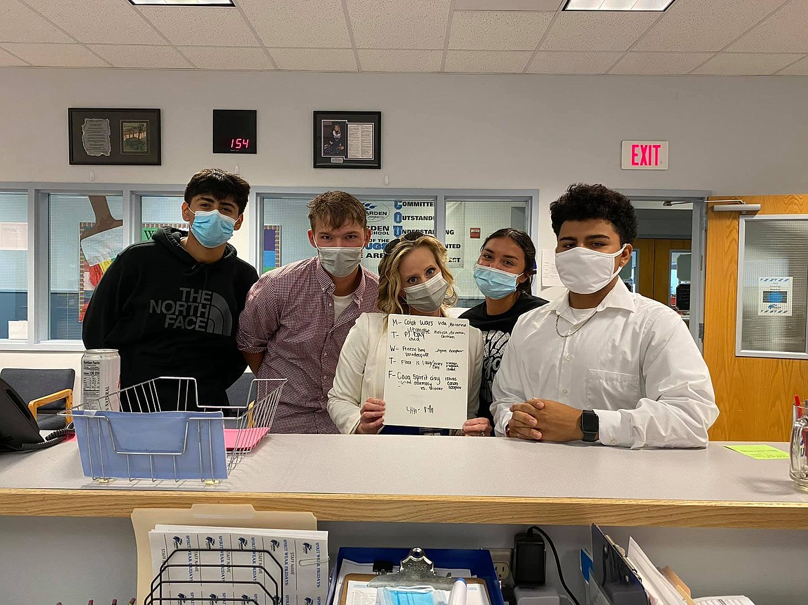 Warden High School Principal Katie Phipps, center, works on spirit week theme ideas with students. Phipps said her favorite part of her job is interacting with students.