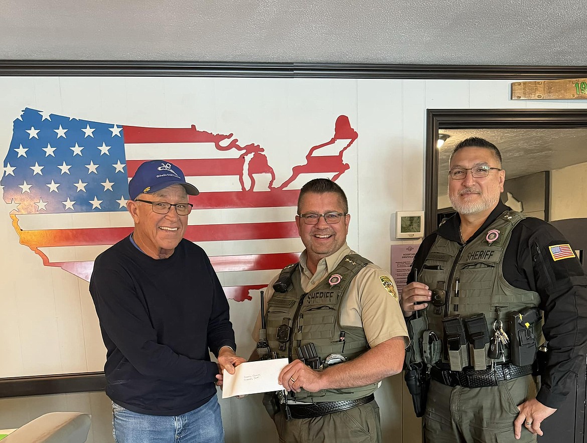 From left: Othello Golf Club owner Jim Deal presents Adams County Sheriff Dale Wagner and Undersheriff Adolfo Coronado with a donation raised through the club’s annual golf tournament last month. The money will go for equipment, training and other necessities for both the Sheriff’s Office and Adams County Fire District 5, according to an announcement from the sheriff’s office.