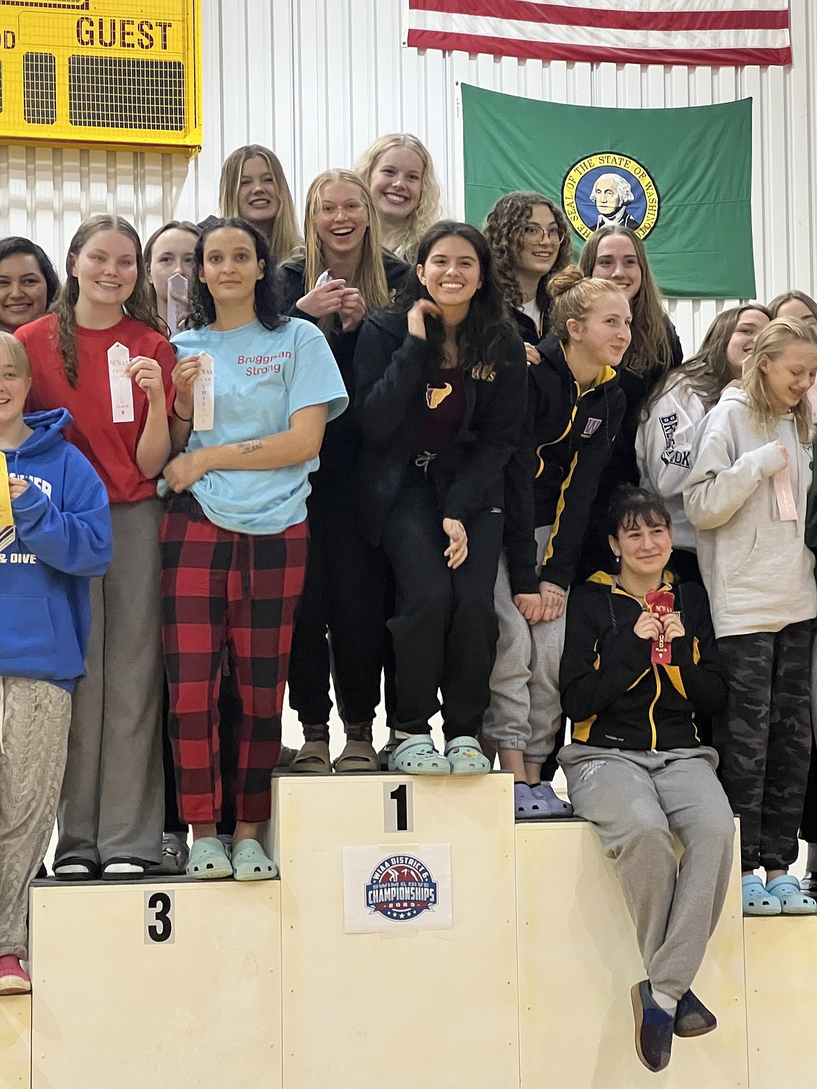 Swimmers stand on the podium at Moses Lake.