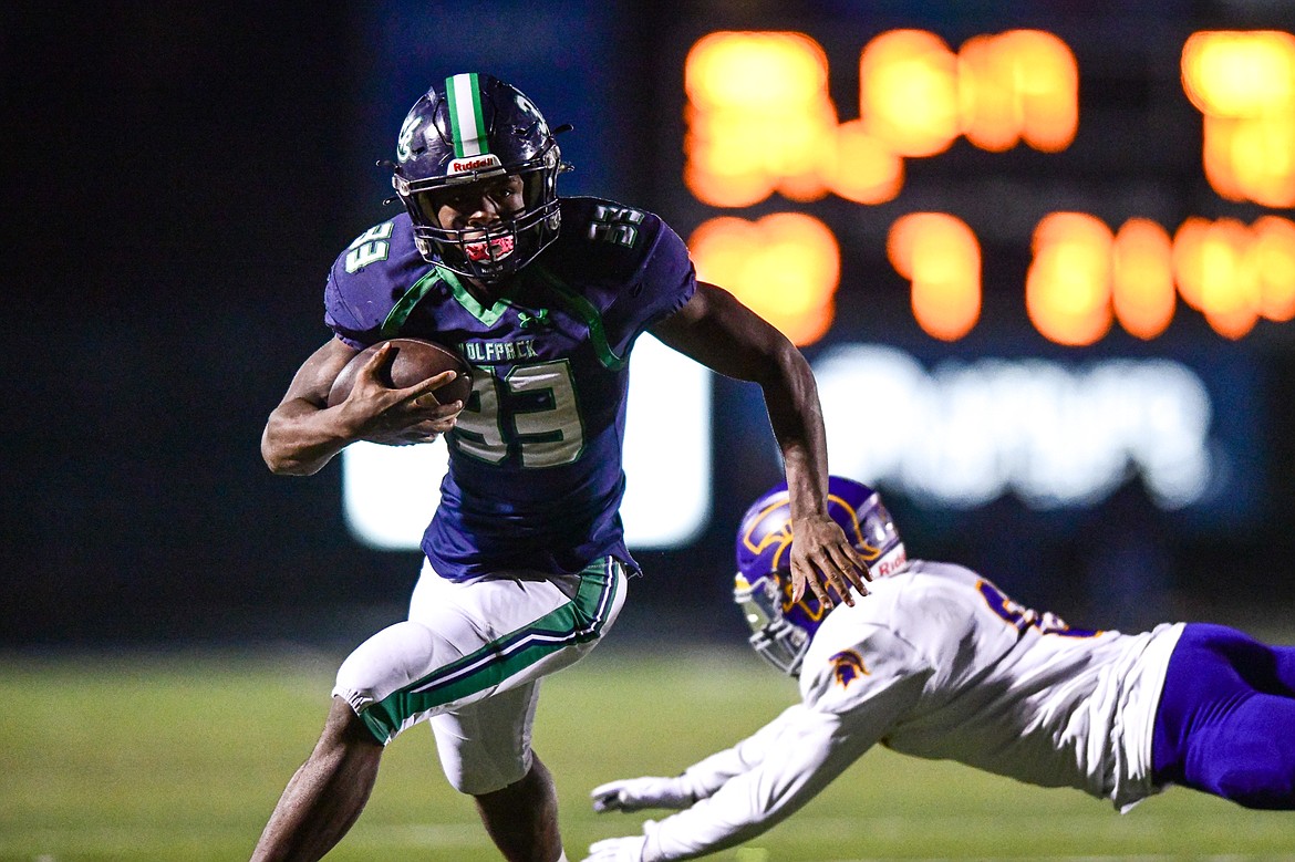 Glacier running back Kobe Dorcheus (33) scores a touchdown on a 21-yard reception in the fourth quarter against Missoula Sentinel in the quarterfinals of the Class AA playoffs at Legends Stadium on Friday, Nov. 3. (Casey Kreider/Daily Inter Lake)