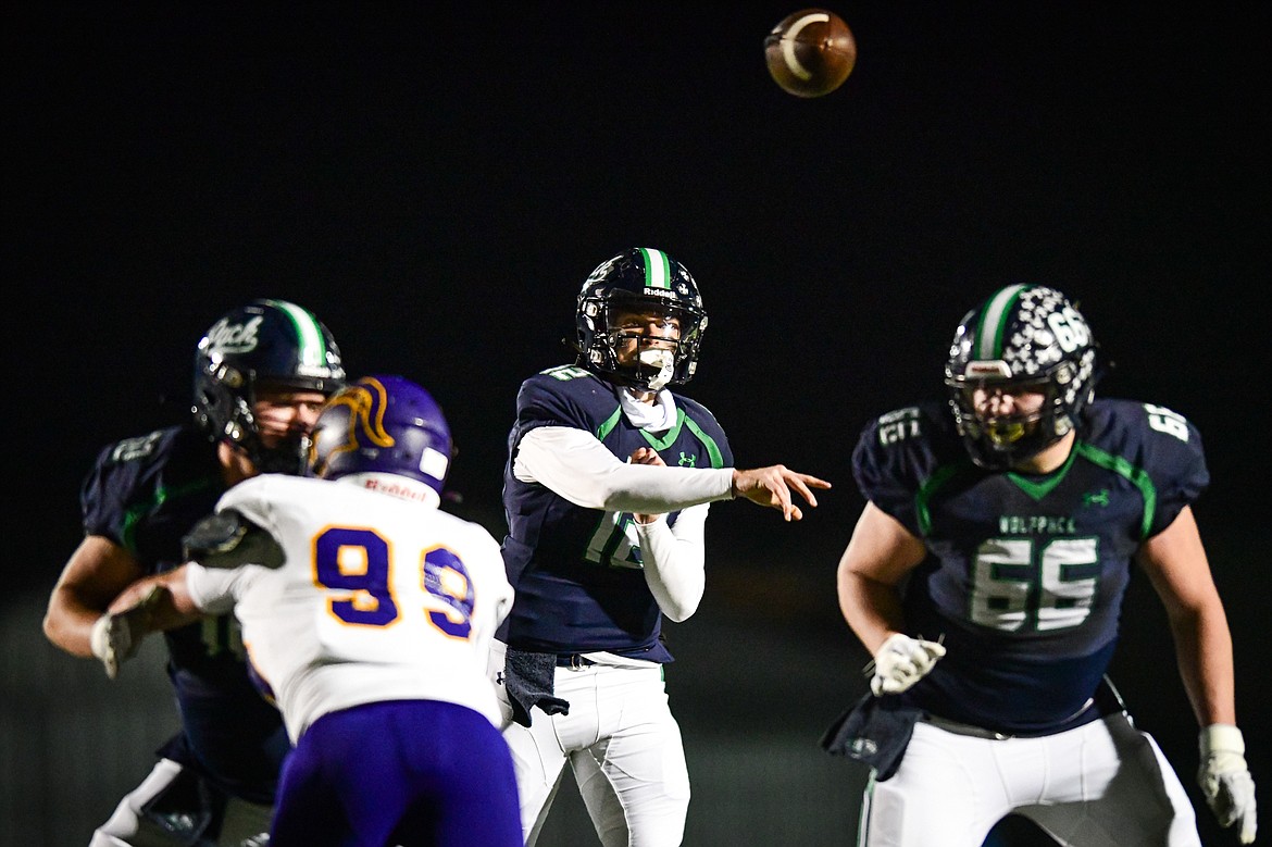 Glacier quarterback Jackson Presley (12) drops back to pass in the second quarter against Missoula Sentinel in the quarterfinals of the Class AA playoffs at Legends Stadium on Friday, Nov. 3. (Casey Kreider/Daily Inter Lake)