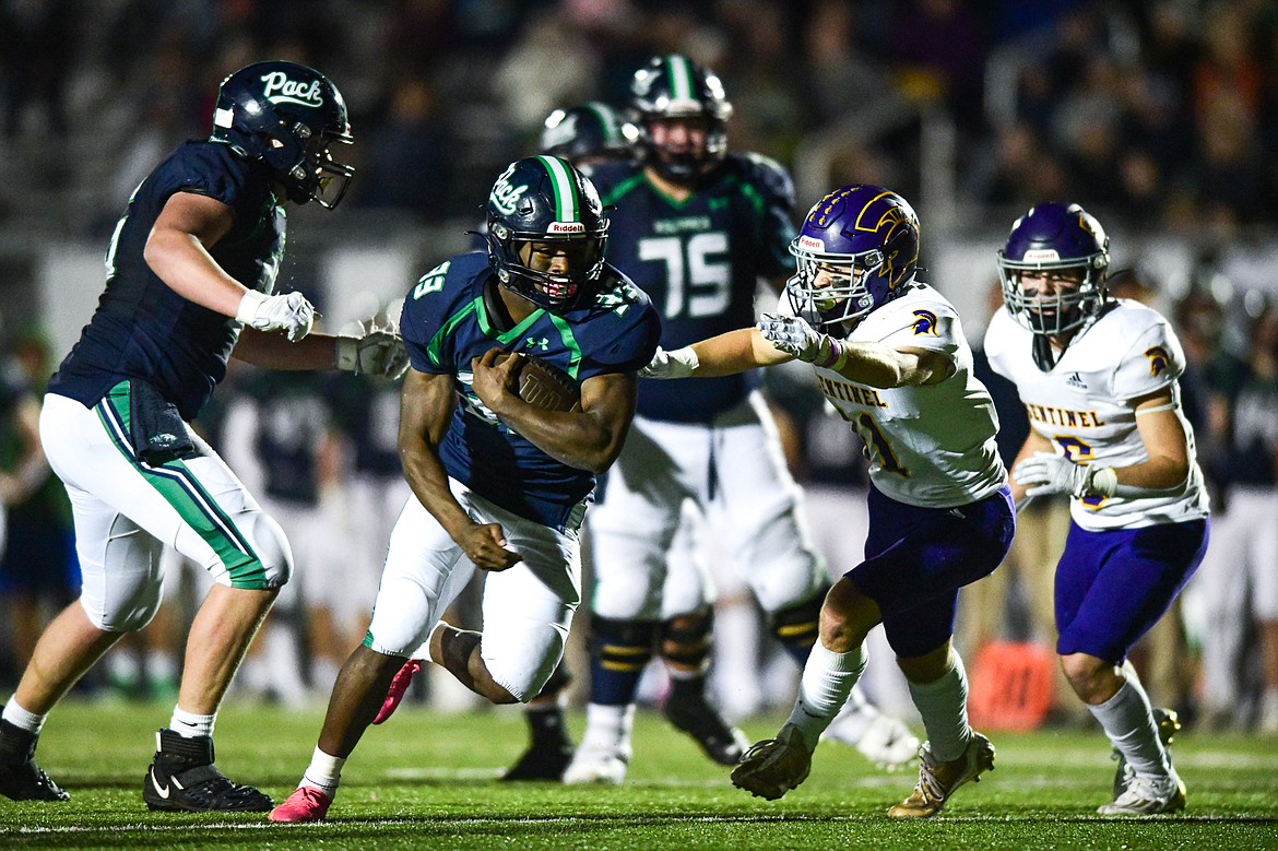 Glacier running back Kobe Dorcheus (33) scores a touchdown on a 17-yard reception in the third quarter against Missoula Sentinel in the quarterfinals of the Class AA playoffs at Legends Stadium on Friday, Nov. 3. (Casey Kreider/Daily Inter Lake)