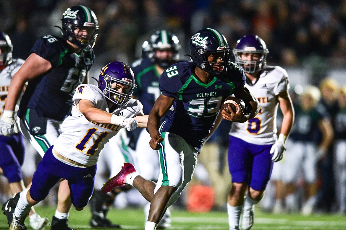 Glacier running back Kobe Dorcheus (33) scores a touchdown on a 17-yard reception in the third quarter against Missoula Sentinel in the quarterfinals of the Class AA playoffs at Legends Stadium on Friday, Nov. 3. (Casey Kreider/Daily Inter Lake)