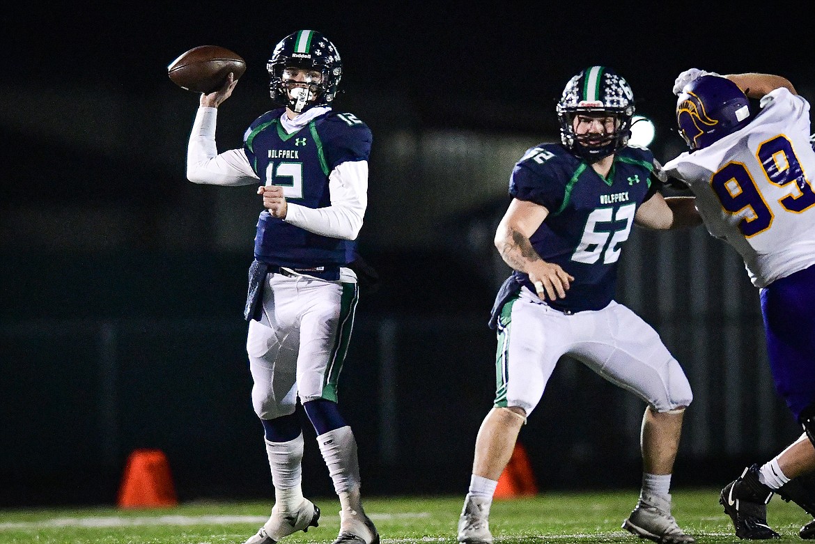 Glacier quarterback Jackson Presley (12) drops back to pass in the first quarter against Missoula Sentinel in the quarterfinals of the Class AA playoffs at Legends Stadium on Friday, Nov. 3. (Casey Kreider/Daily Inter Lake)