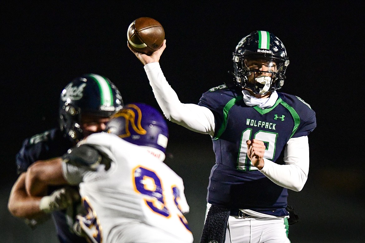 Glacier quarterback Jackson Presley (12) drops back to pass in the second quarter against Missoula Sentinel in the quarterfinals of the Class AA playoffs at Legends Stadium on Friday, Nov. 3. (Casey Kreider/Daily Inter Lake)