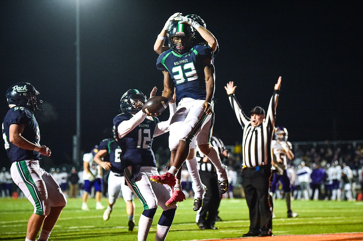 Glacier running back Kobe Dorcheus (33) celebrates with teammates after a 21-yard touchdown reception in the fourth quarter against Missoula Sentinel in the quarterfinals of the Class AA playoffs at Legends Stadium on Friday, Nov. 3. (Casey Kreider/Daily Inter Lake)