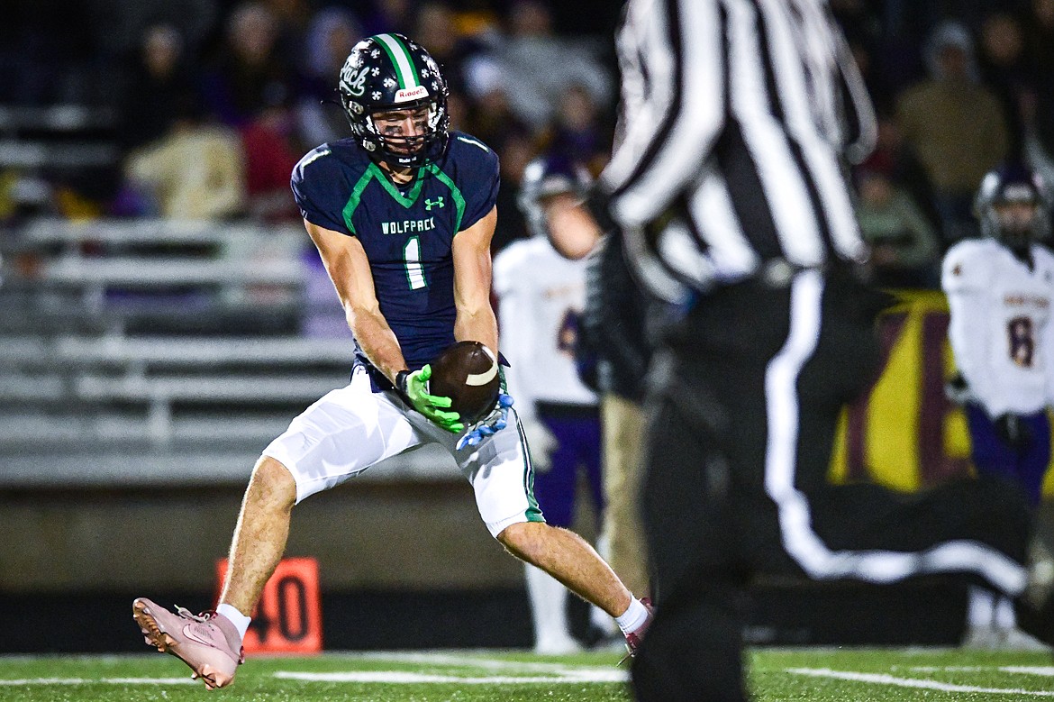 Glacier wide receiver Cohen Kastelitz (1) catches a 75-yard touchdown reception in the third quarter against Missoula Sentinel in the quarterfinals of the Class AA playoffs at Legends Stadium on Friday, Nov. 3. (Casey Kreider/Daily Inter Lake)