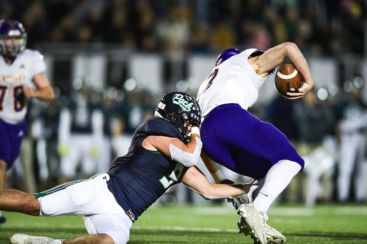 Glacier defensive lineman Isaac Keim (9) sacks Missoula Sentinel quarterback Danny Sirmon (3) in the first quarter of the quarterfinals of the Class AA playoffs at Legends Stadium on Friday, Nov. 3. (Casey Kreider/Daily Inter Lake)