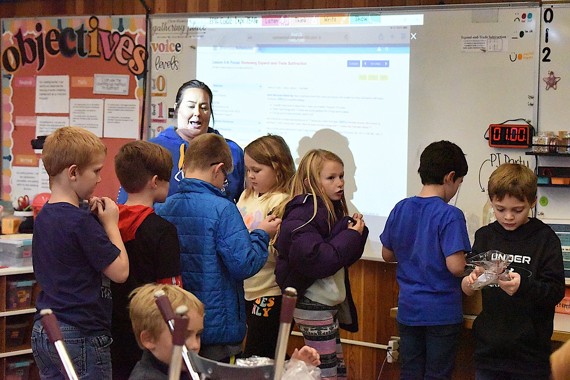 Libby third-grade teacher Kassandra Keller's students enjoyed getting goodie bags from Logger high school students on Friday, Nov. 3, during Red Ribbon Week. Keller's class won the contest for best door decorations, which will result in a root beer float party this week. (Scott Shindledecker/The Western News)