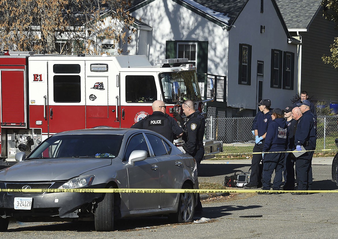 Police respond to the scene of a fatal shooting in Billings, Mont., Wednesday, Nov. 1, 2023. A 31-year-old man was shot and a 1-year-old boy suffered fatal injuries after gunfire was sprayed into their residence. The police chief said it appeared the man collapsed from his injuries and fell on the child, who was unresponsive when officers arrived and died at the hospital. Police have identified suspects in the shooting, but nobody has been charged. (Larry Mayer/The Billings Gazette via AP)