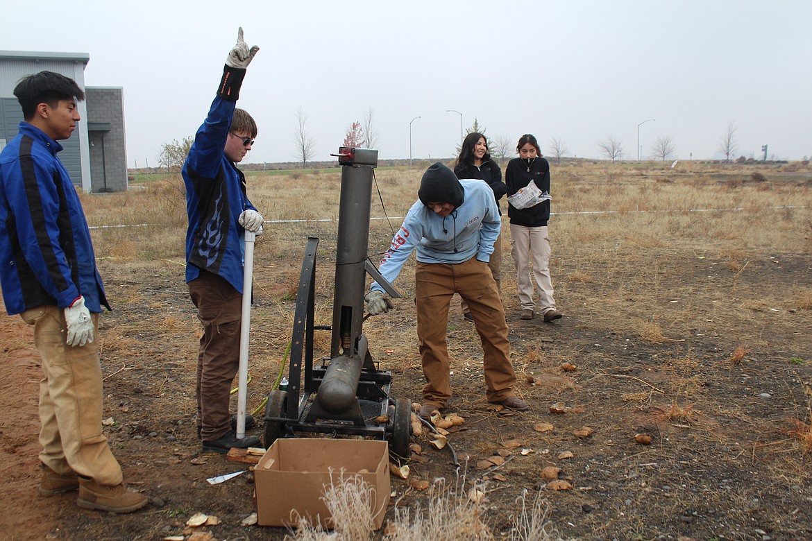 Skills center students lead the countdown to launching french fries during Potato Days.