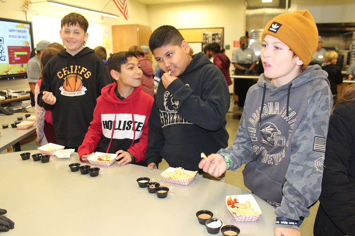 Fifth graders test the dipping sauces prepared by Skills Center culinary students.