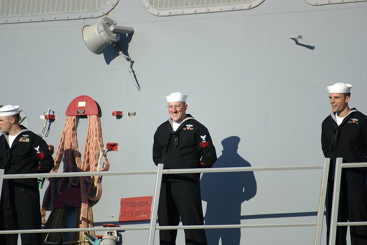 Dustin Woelfle is pictured aboard ship at the end of a seven-month deployment.