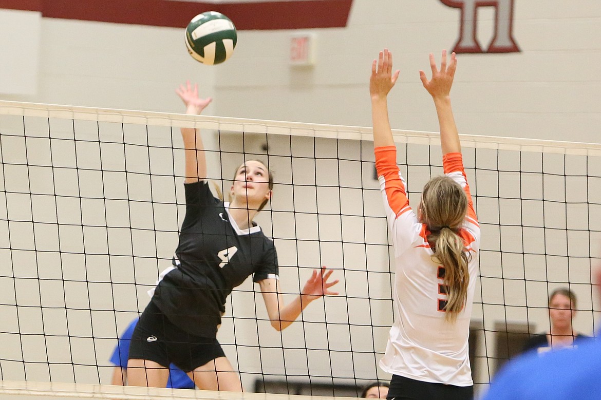 ACH senior Natalie Evers (4) spikes the ball against Odessa.