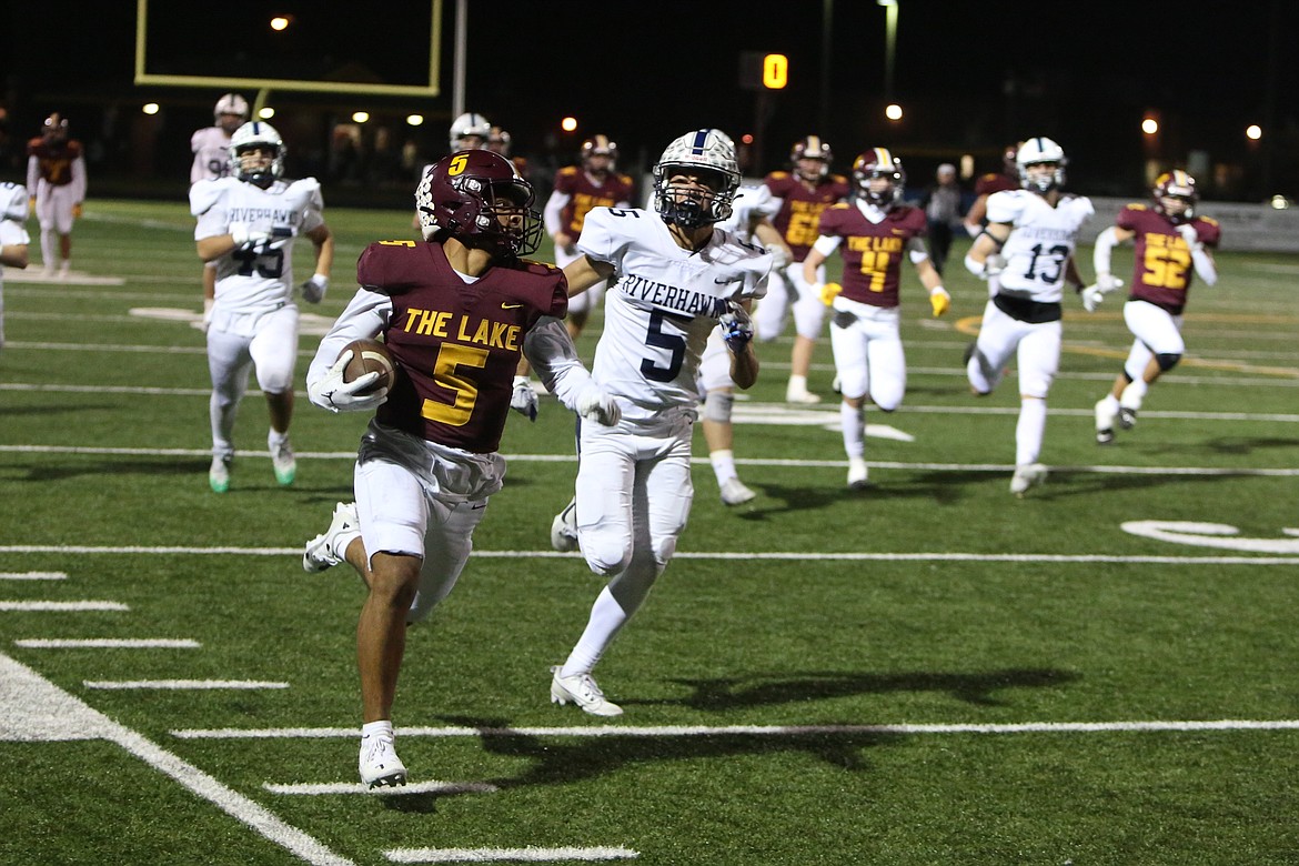 Moses Lake receiver Kyson Thomas (5) runs up the sideline on a 65-yard touchdown catch.