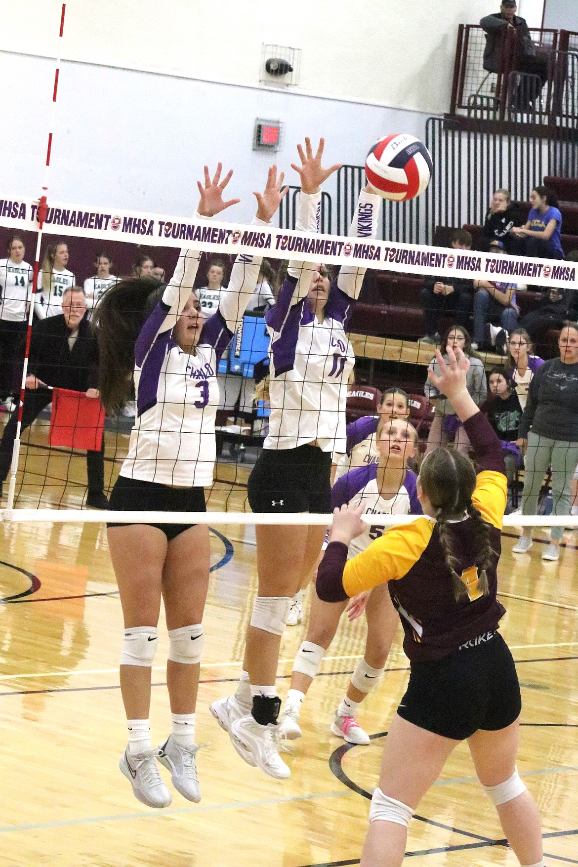 Lady Vikings Leah Cahoon and Darcy Coleman block the ball during last week's Class C Divisional Tournament. (Michelle Sharbono photo)