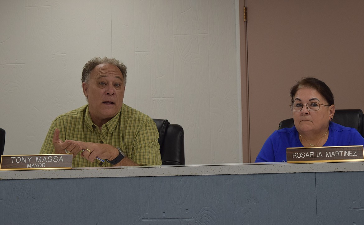 Warden Mayor Tony Massa, left, and Mayor-elect Rosaelia Martinez at a Sept. 12 council meeting. Massa has served as Mayor for about 12 years.