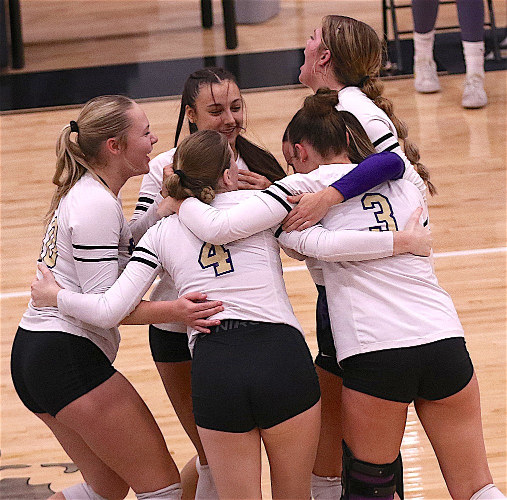 The Lady Pirates celebrate their impending trip to Bozeman for the State A Volleyball Tournament. (Bob Gunderson photo)