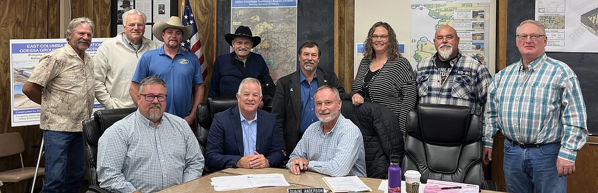 Standing from left to right: East Columbia Basin Irrigation District Board Member Don Osborne, ECBID Board Member Reid Baker, ECBID Development Coordinator Jon Erickson, Washington State Rep. Tom Dent, Washington State Sen. Mark Schoesler, Washington State Department of Ecology Financial and Projects Section Manager Melissa Downes, ECBID Board Member Dennis Swinger, ECBID Board Member Kevin Lyle. Seated from left to right: ECBID Secretary-Manager Craig Simpson, Washington State Department of Ecology’s Office of Columbia River Director Tom Tebb, ECBID Board President Duaine Anderson.