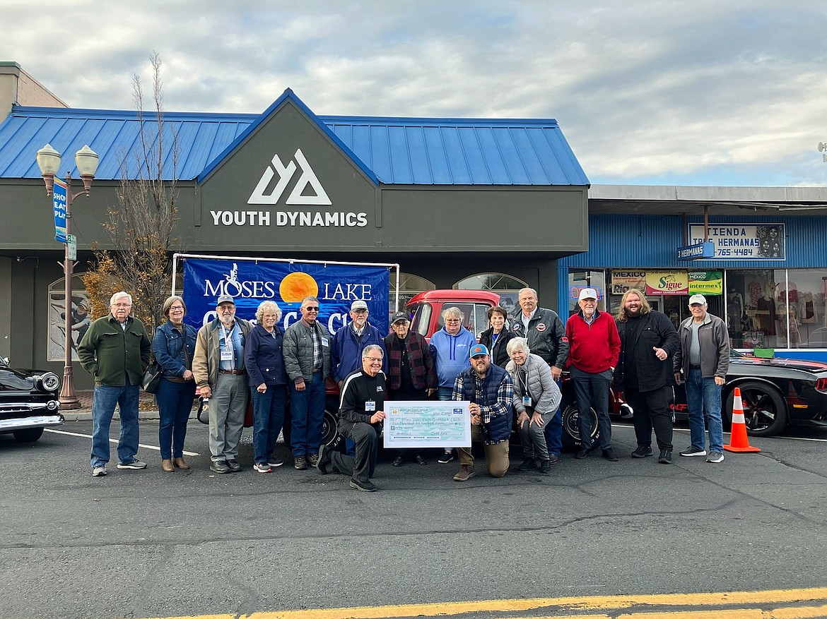 Members of the Moses Lake Classic Car Club donated $1,111 to Youth Dynamics of Moses Lake after the club’s “show and shine” Nov. 5.