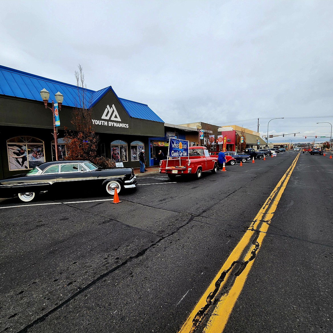 Cool cars from the Moses Lake Classic Car Club line the street outside Youth Dynamics Nov. 5.