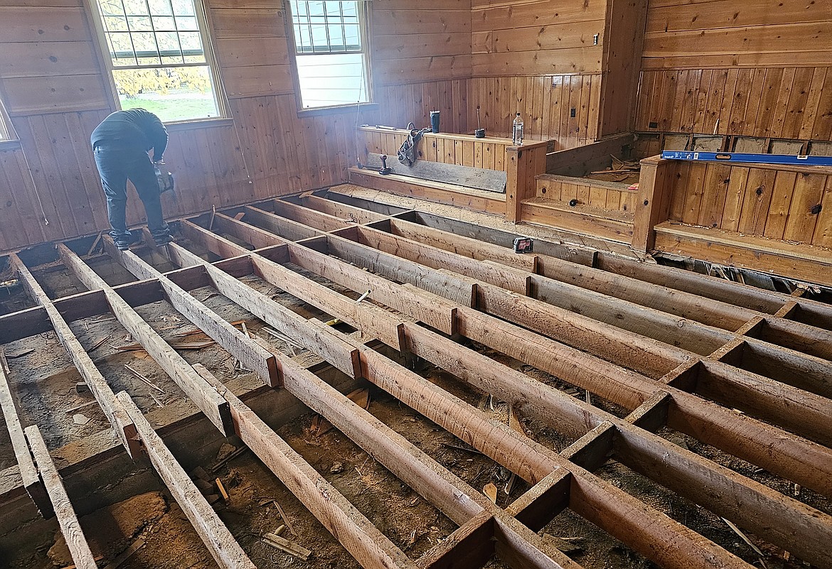Floor joists are exposed during renovations to the old sanctuary at Lakeside Community Chapel in this photo taken in September or October 2023. The wood is thought by church members to have been harvested from old-growth trees. (Photo provided)