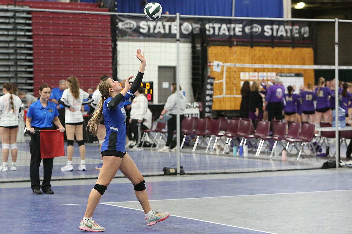 Warden senior Lauryn Madsen serves the ball during the Cougars’ match against Adna.