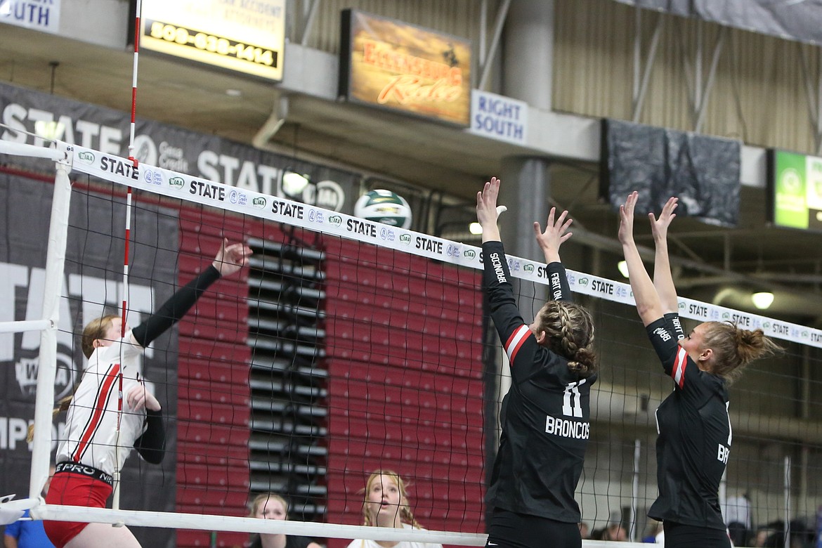 LRS senior Megan Melcher (11) and junior Claire Wellsandt (10) attempt a block against Coupeville.