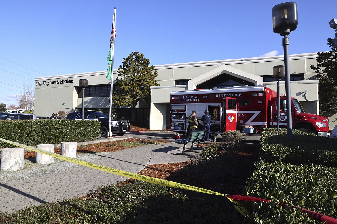 Emergency and law enforcement agencies respond to a possible hazmat situation at the King County Elections office in Renton, Wash., Wednesday, Nov. 8, 2023. Four county elections offices in Washington state were evacuated Wednesday after they received envelopes containing suspicious powders — including two that field-tested positive for fentanyl — while workers were processing ballots from Tuesday’s election. (Karen Ducey/The Seattle Times via AP)