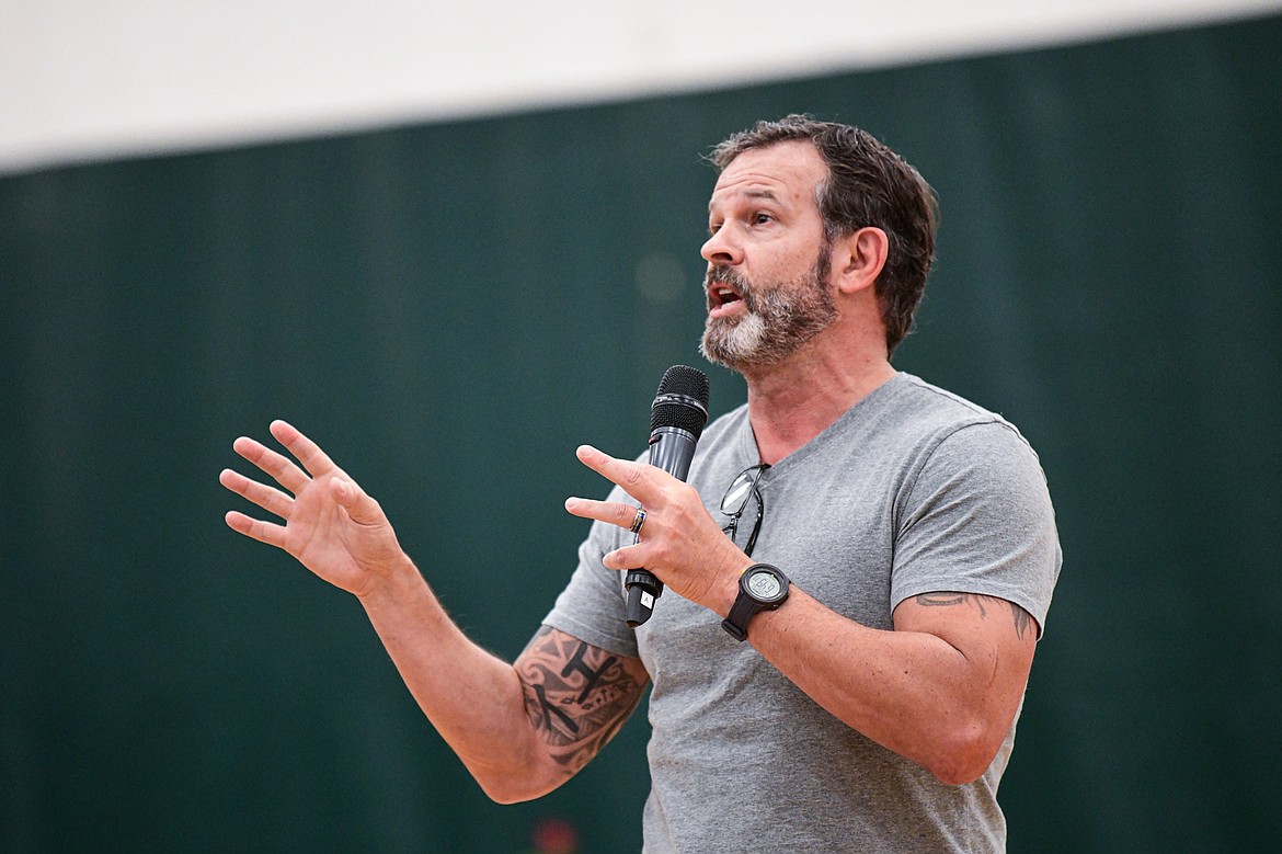 Shawn Osborne, a pastor at Bethany Lutheran Church in Bigfork who served with the Air National Guard, Army Rangers and as a Navy Chaplain, speaks at the Veterans Day Community Event at Whitefish High School on Thursday, Nov. 9. (Casey Kreider/Daily Inter Lake)