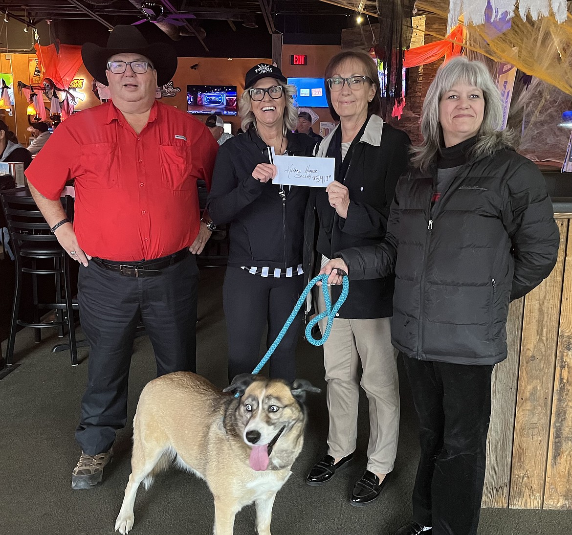 Companions Animal Center, formally Kootenai Humane Society, received a donation of $5,413 from the Dog Days of Summer event conducted at Rusty's Sports Bar in Hayden. The funds go directly to the center's medical relief program to help with the cost of drugs and supplys. From left: Dean Opsal, Southern Glazers Voluncheers Ambassador for Idaho; Kelly Jo Arnold, GM Rusty's Sports Bar; Vicky Nelson and Anime Parisot, Companions Animal Center shelter; and Shirley, a female shepherd mix. She is sweet, friendly and is in need a good home.