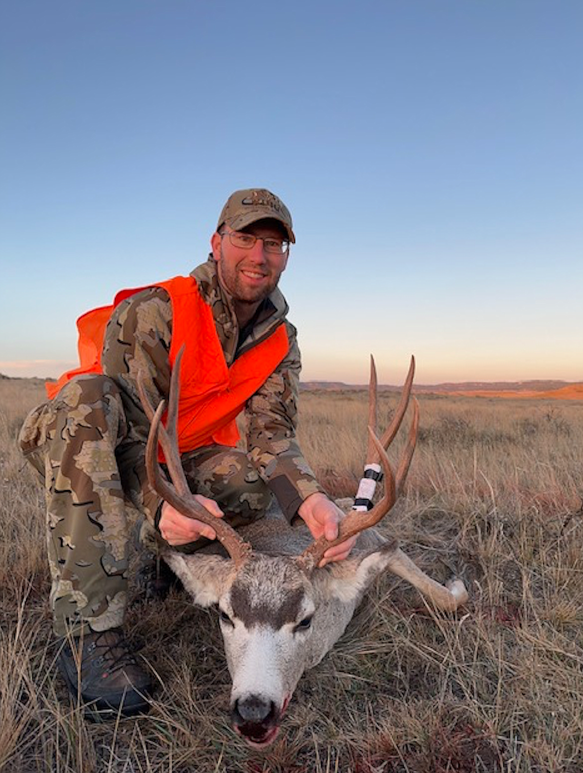 Matt Hankes, who underwent a heart transplant surgery in February, is seen with a buck he bagged in mid-October during a hunting trip.