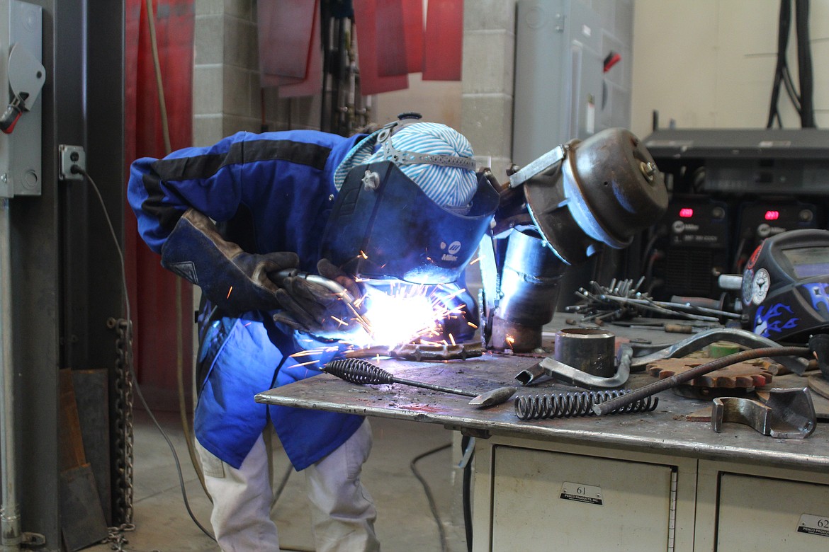 Saira Lombera works on her team’s sculpture in the metal art contest Thursday at Columbia Basin Technical Skills Center