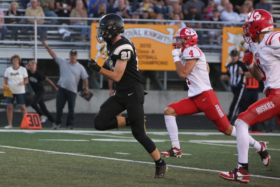 Royal junior Jackson Larsen (21) runs upfield with the ball against Othello on Sept. 8.