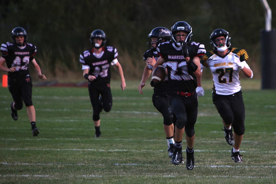 ACH sophomore Brady Roberts (21) returns a kickoff for a touchdown against Liberty Bell on Sept. 16. The Warriors have already played three teams that made the 1B State Football Tournament.